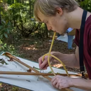 Evan, from the Young Scholars Program, working in the field